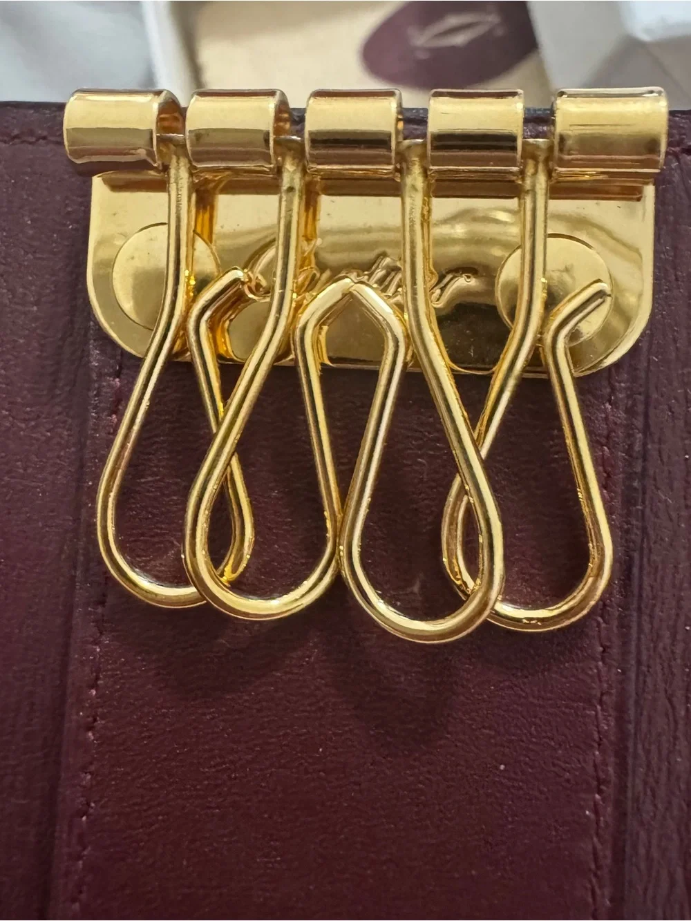 Cartier Burgundy Leather Key  Holder with Gold Accents.